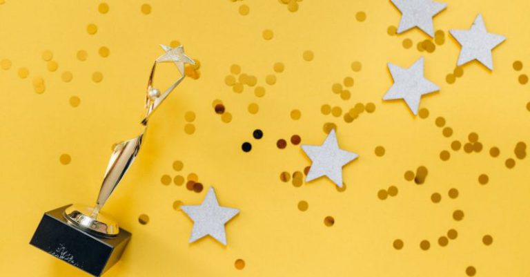 Followers Trophy - Golden Statuette and Stars on Yellow Background