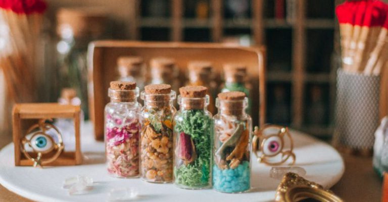 Firefly Jar - A table with several jars of different colored powders