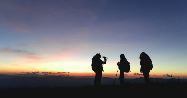 Team Mountain - Silhouette of Three People