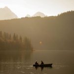 Routine Sunrise - Person Riding on Boat on Lake