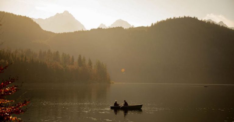 Routine Sunrise - Person Riding on Boat on Lake