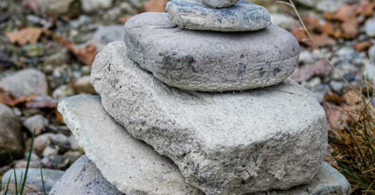 Balance Stones - White Stone on Brown Dried Leaves