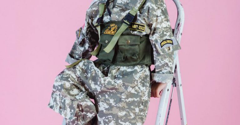 Dreams Ladder - Smiling little Asian boy in navy uniform on ladder